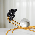 Modern Black Thinker Sculptures on Gold Arch with Crystal Sphere - The Golden Theory
