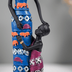 Mother and Child Sculpture with Vibrant Tribal Patterns - The Golden Theory