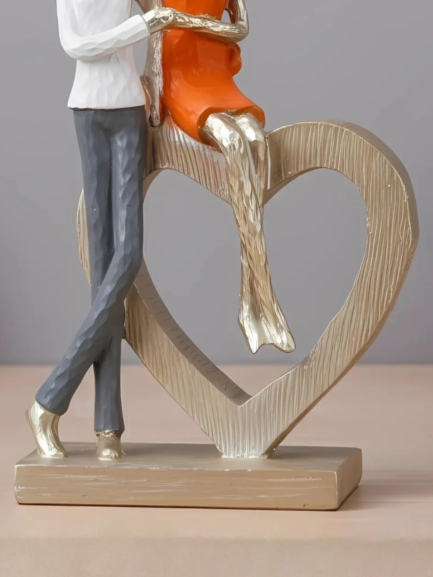 Romantic Couple with Heart Sculpture Secondary image