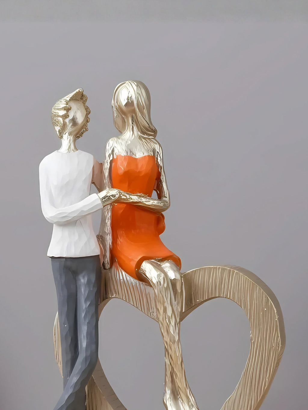 Romantic Couple with Heart Sculpture - The Golden Theory