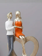 Romantic Couple with Heart Sculpture - The Golden Theory