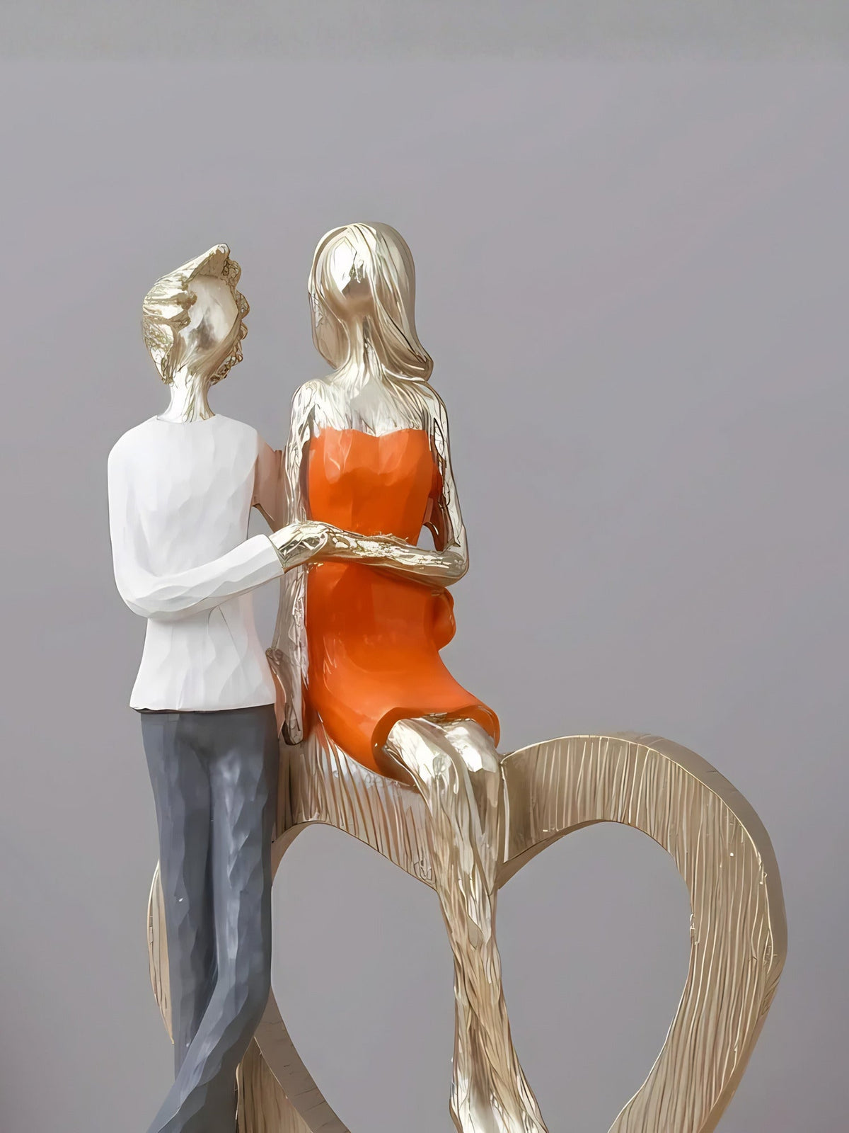 Romantic Couple with Heart Sculpture - The Golden Theory