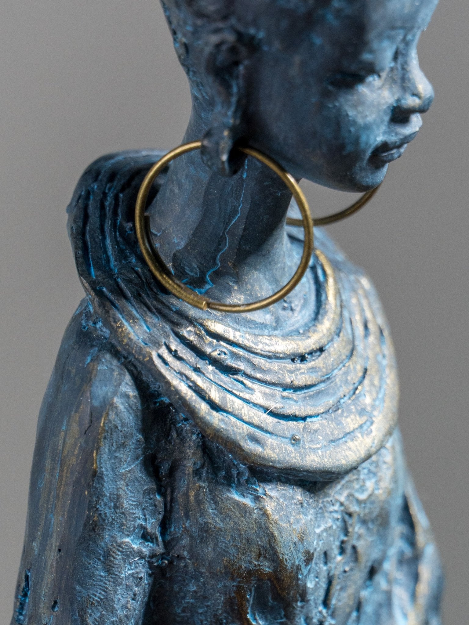 Seated Woman Sculpture on Wood Textured Pedestal – Forward-Facing Figure Statue - The Golden Theory