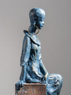 Seated Woman Sculpture on Wood Textured Pedestal – Forward-Facing Figure Statue - The Golden Theory