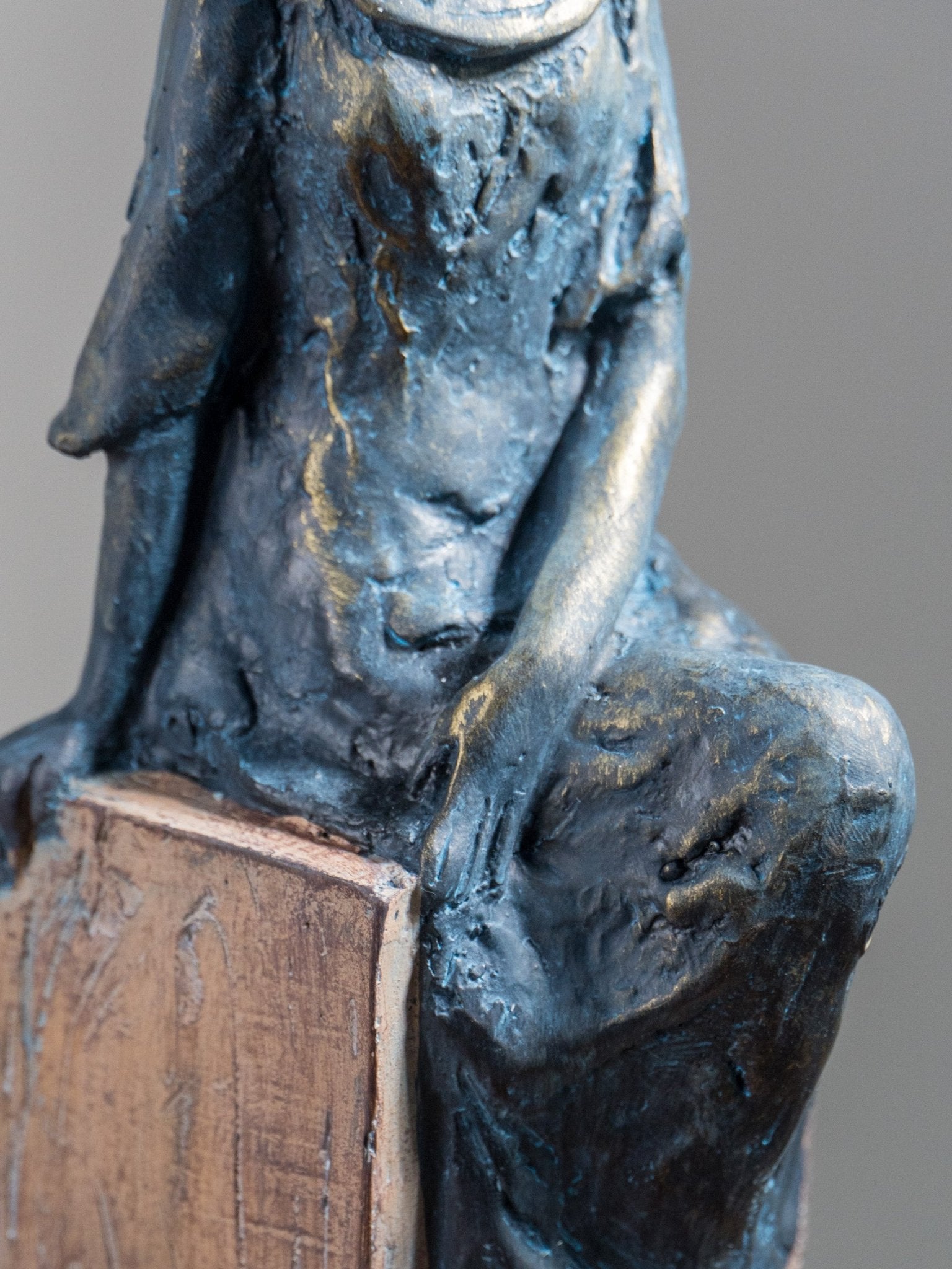 Seated Woman Sculpture on Wood Textured Pedestal – Forward-Facing Figure Statue - The Golden Theory