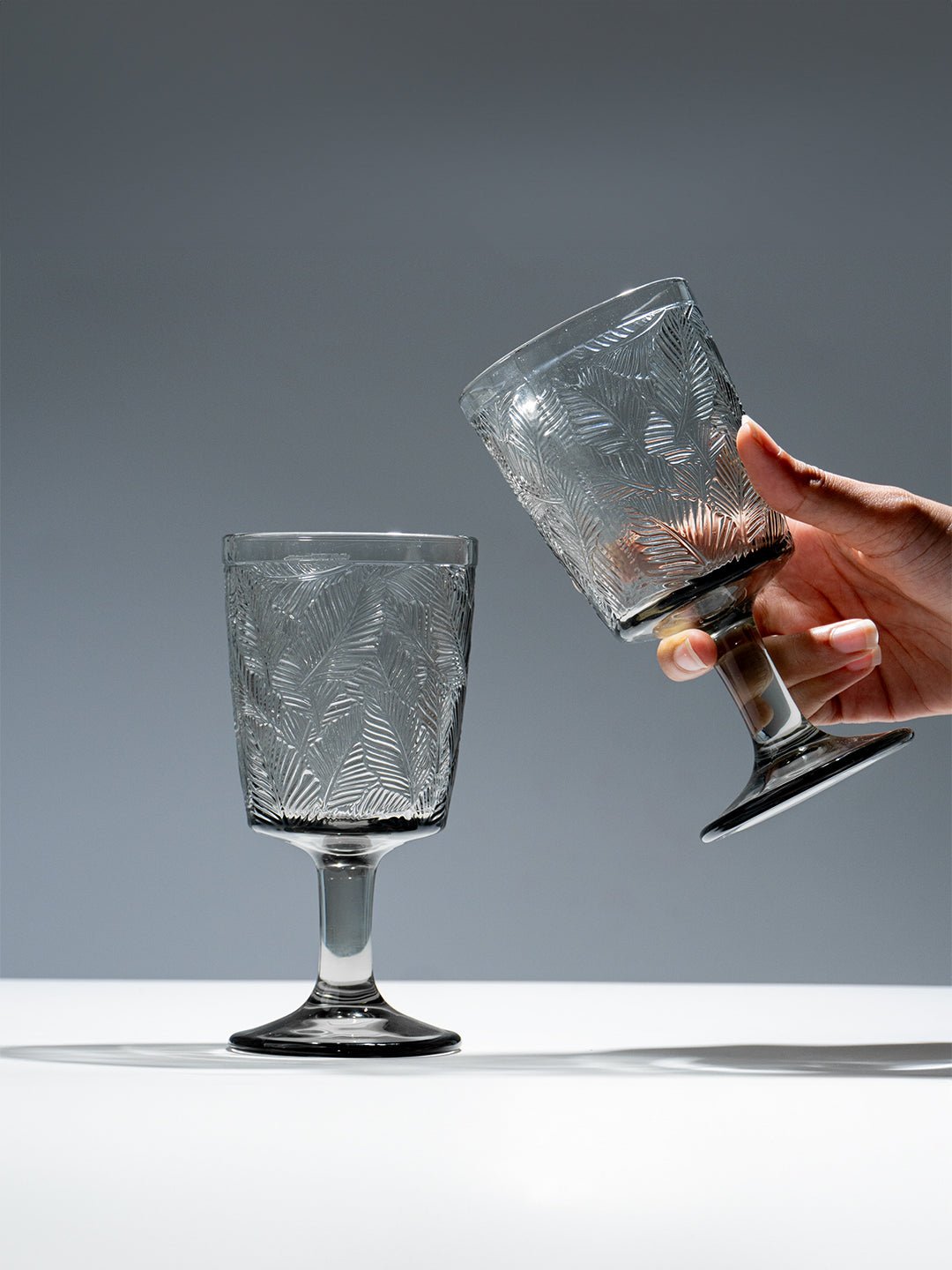 Smoky Black Palm Leaf Embossed Glass Goblet - The Golden Theory