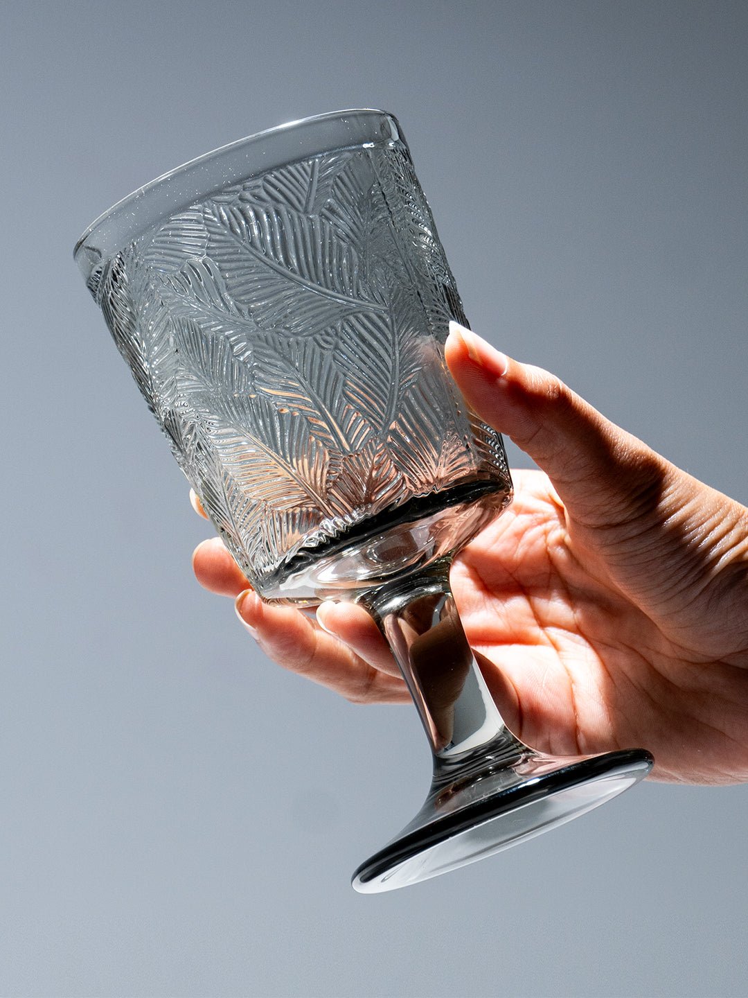 Smoky Black Palm Leaf Embossed Glass Goblet - The Golden Theory