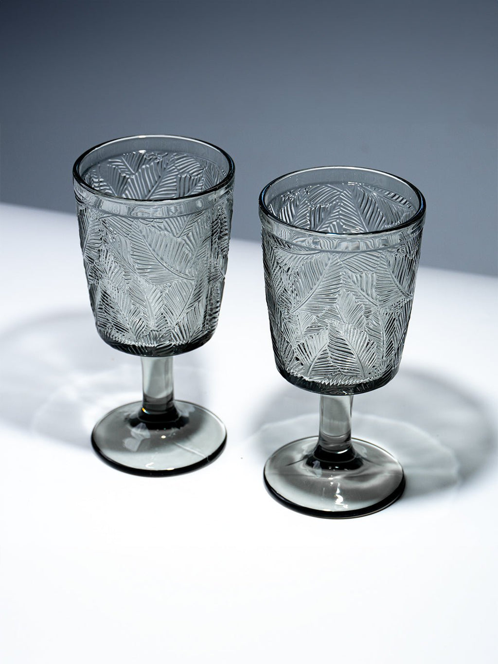 Smoky Black Palm Leaf Embossed Glass Goblet - The Golden Theory