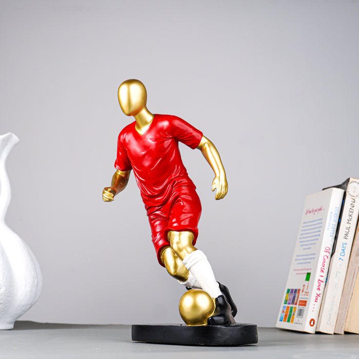 Soccer Player Sculpture in Red Uniform - The Golden Theory