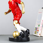 Soccer Player Sculpture in Red Uniform - The Golden Theory