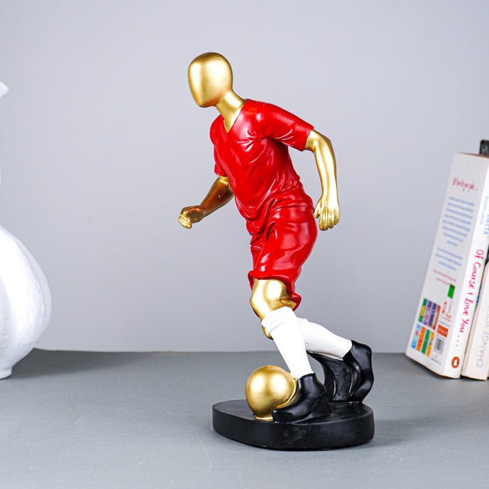 Soccer Player Sculpture in Red Uniform - The Golden Theory