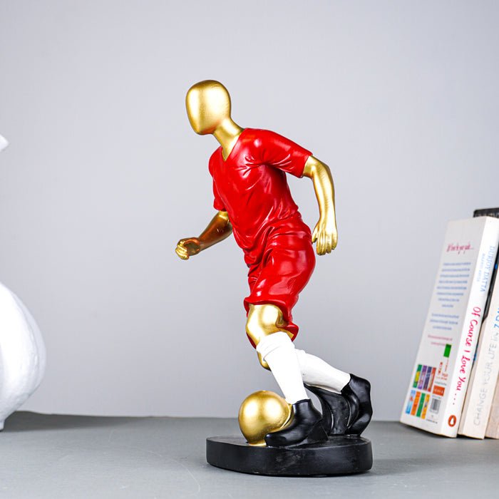 Soccer Player Sculpture in Red Uniform - The Golden Theory