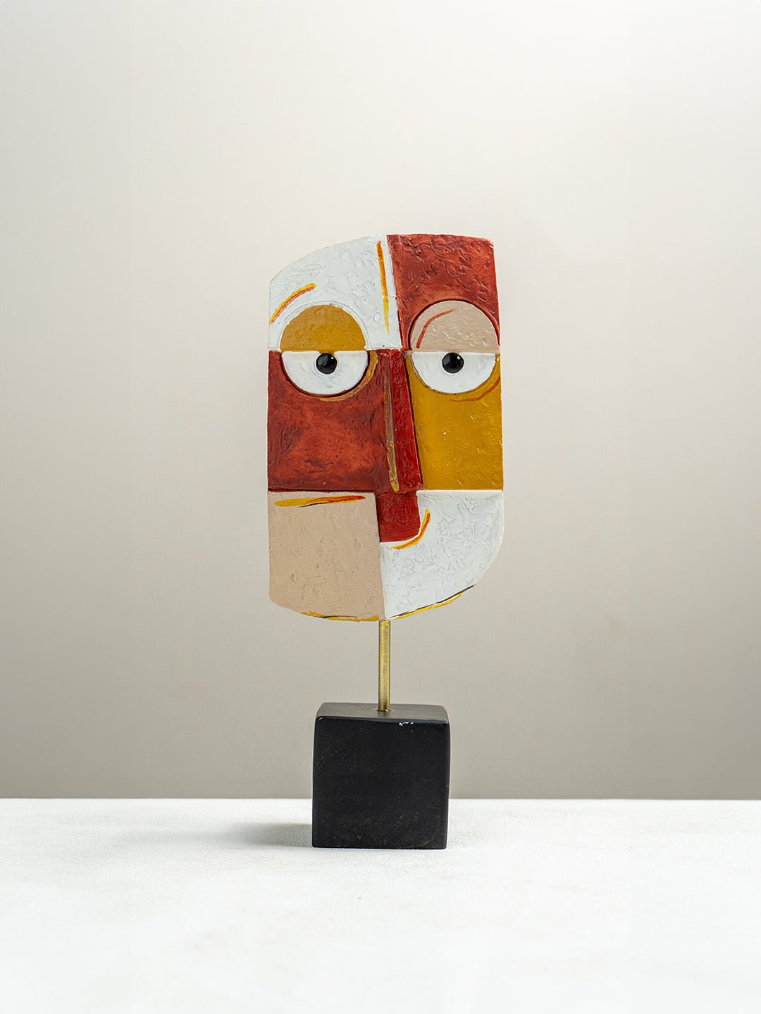 Vibrant Abstract Face Sculpture in Red, Yellow, and White - The Golden Theory Main image