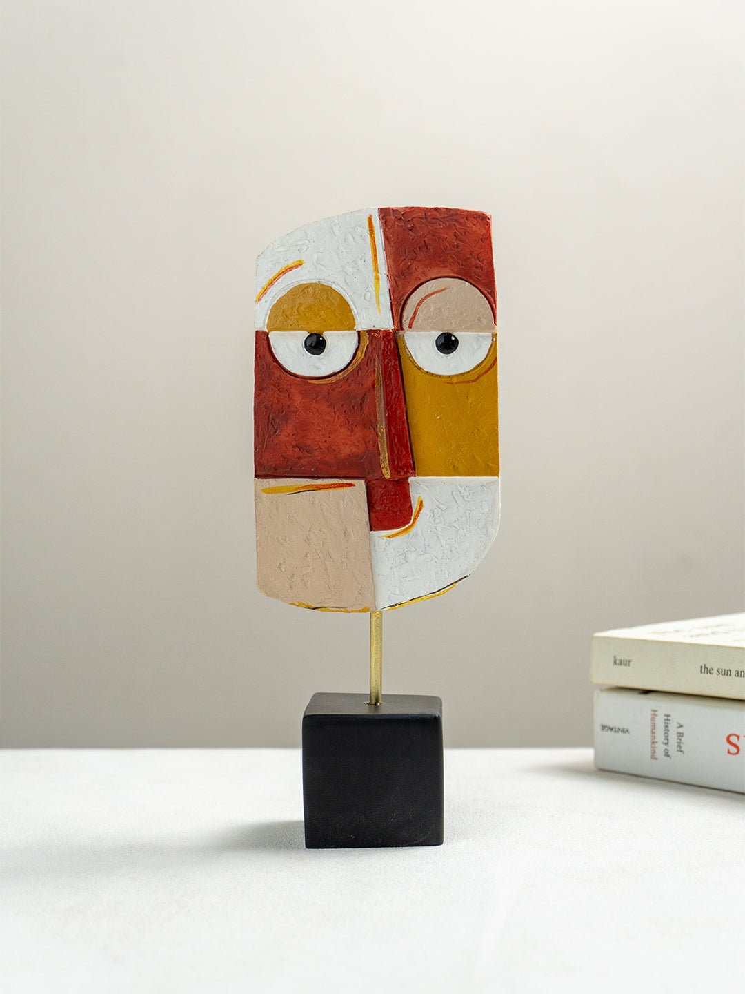 Vibrant Abstract Face Sculpture in Red, Yellow, and White - The Golden Theory