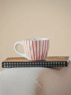 White Ceramic Cup with Hand-Painted Red Stripes - The Golden Theory