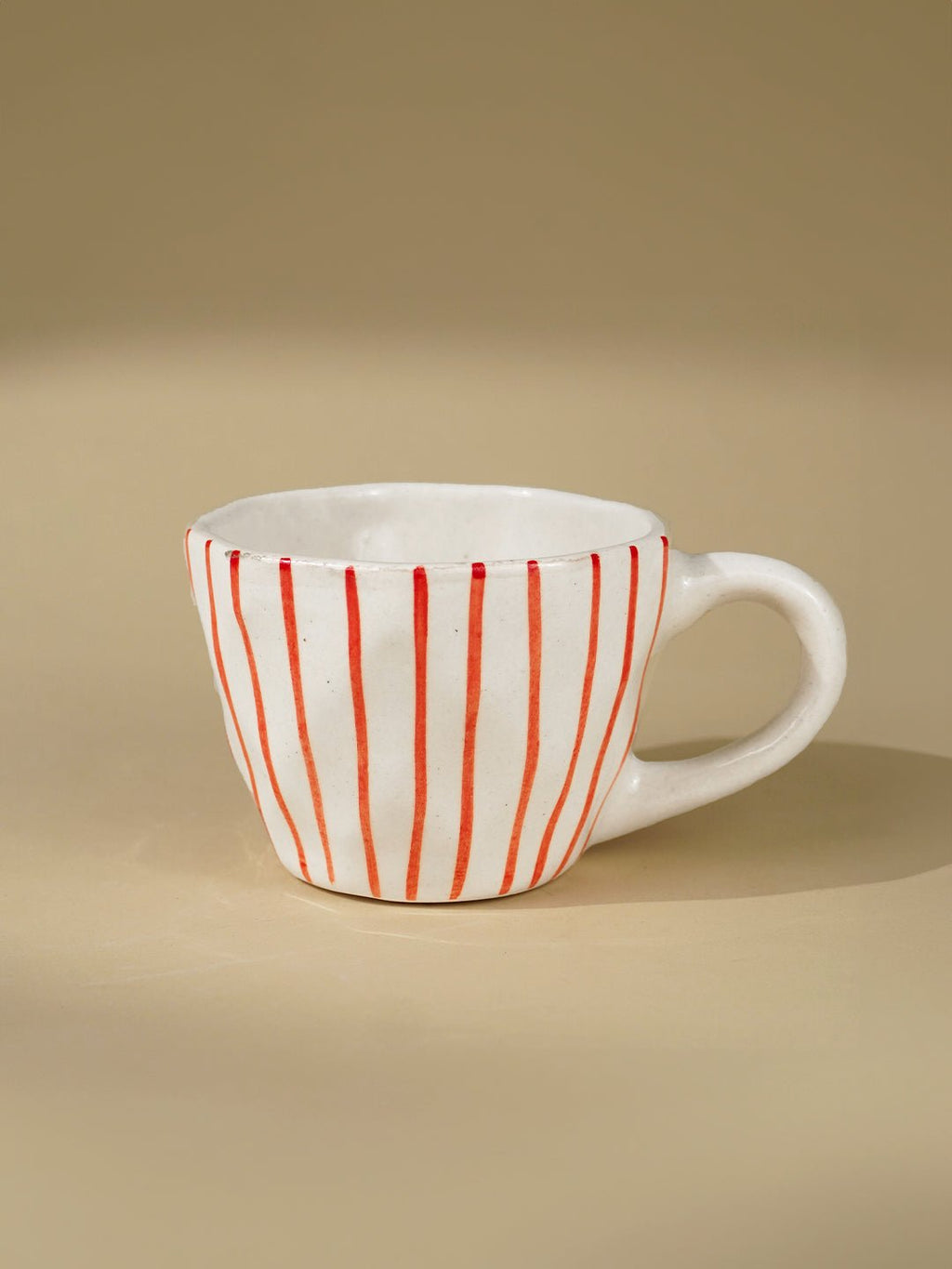 White Ceramic Cup with Hand-Painted Red Stripes - The Golden Theory