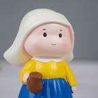 Yellow and Blue Dutch Girl Figurine with White Bonnet - The Golden Theory